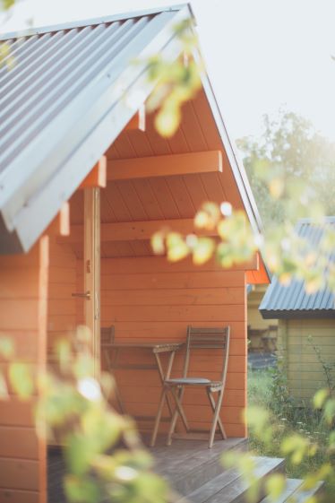 Photo by Elina Sazonova: https://www.pexels.com/photo/chair-beside-table-in-front-of-an-orange-wooden-shed-3099658/ Photo by Elina Sazonova: https://www.pexels.com/photo/chair-beside-table-in-front-of-an-orange-wooden-shed-3099658/
